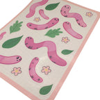 Close up of pink worm sticker sheet with cartoon earthworms, leaves and flowers shown on a white background 