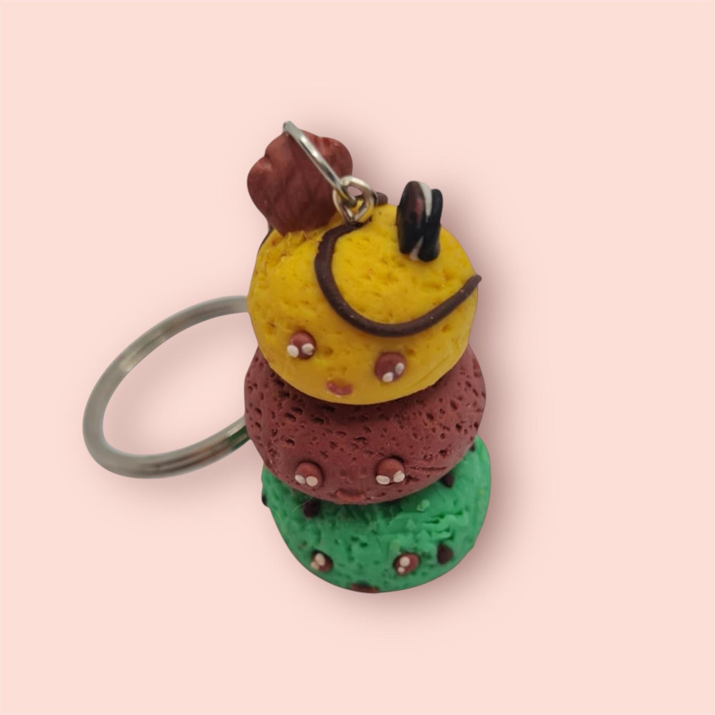 Colorful layered keychain on a pink background