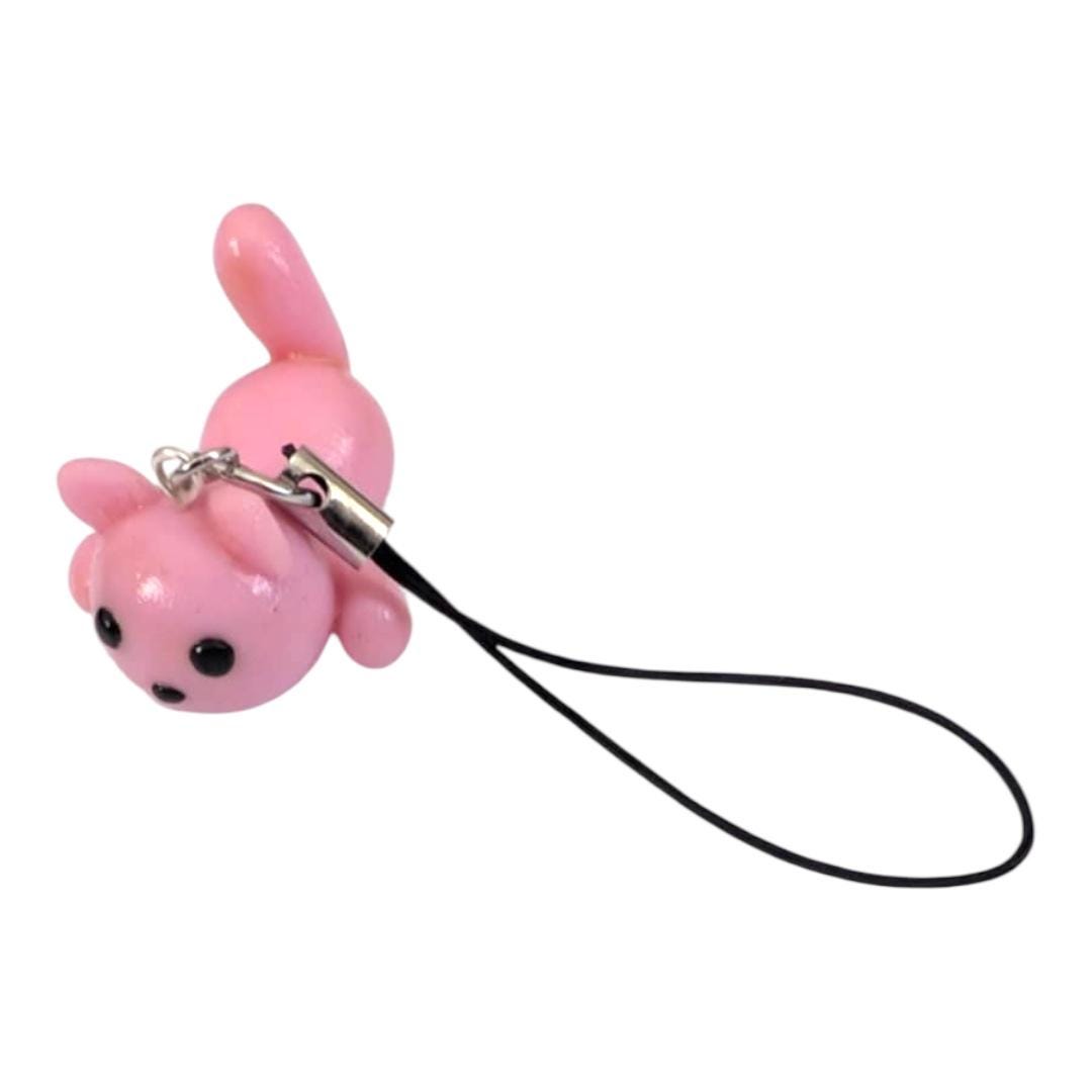 Pink cartoon character charm with a black strap on a white background