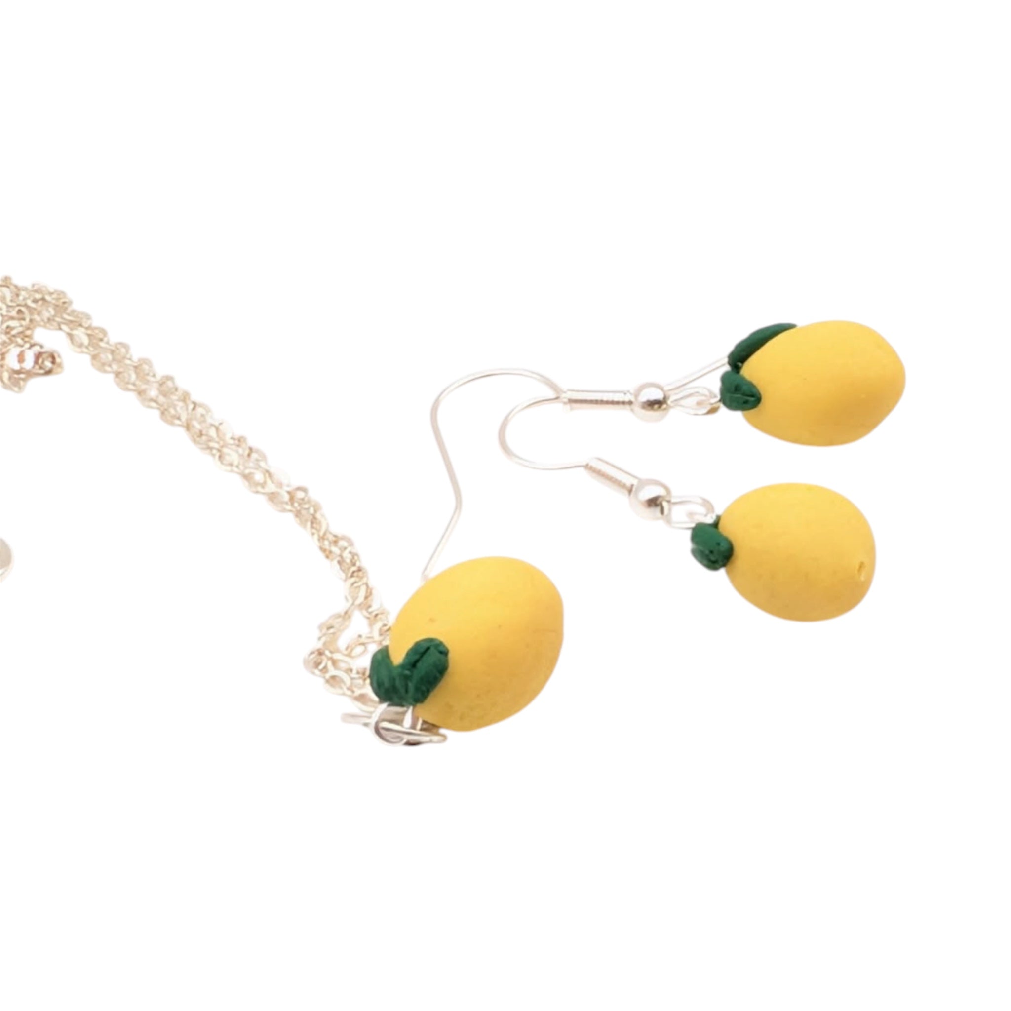 Cute yellow lemon necklace and earrings set with silver plated chain and ear wires.
