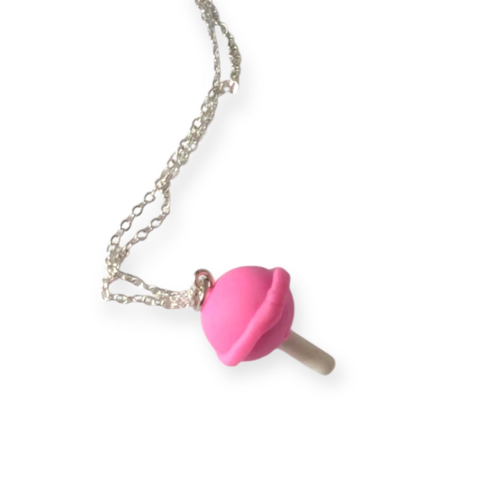Necklace with a pink candy pendant on a white background