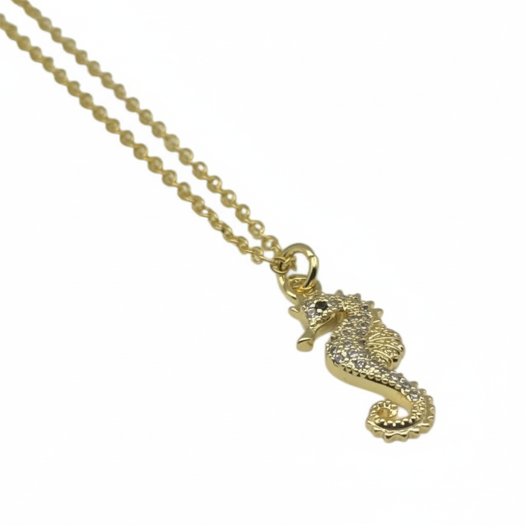 Gold seahorse necklace pendant with sparkling zirconia detail and delicate chain, ocean jewellery