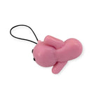 Pink cat shaped keychain on a white background
