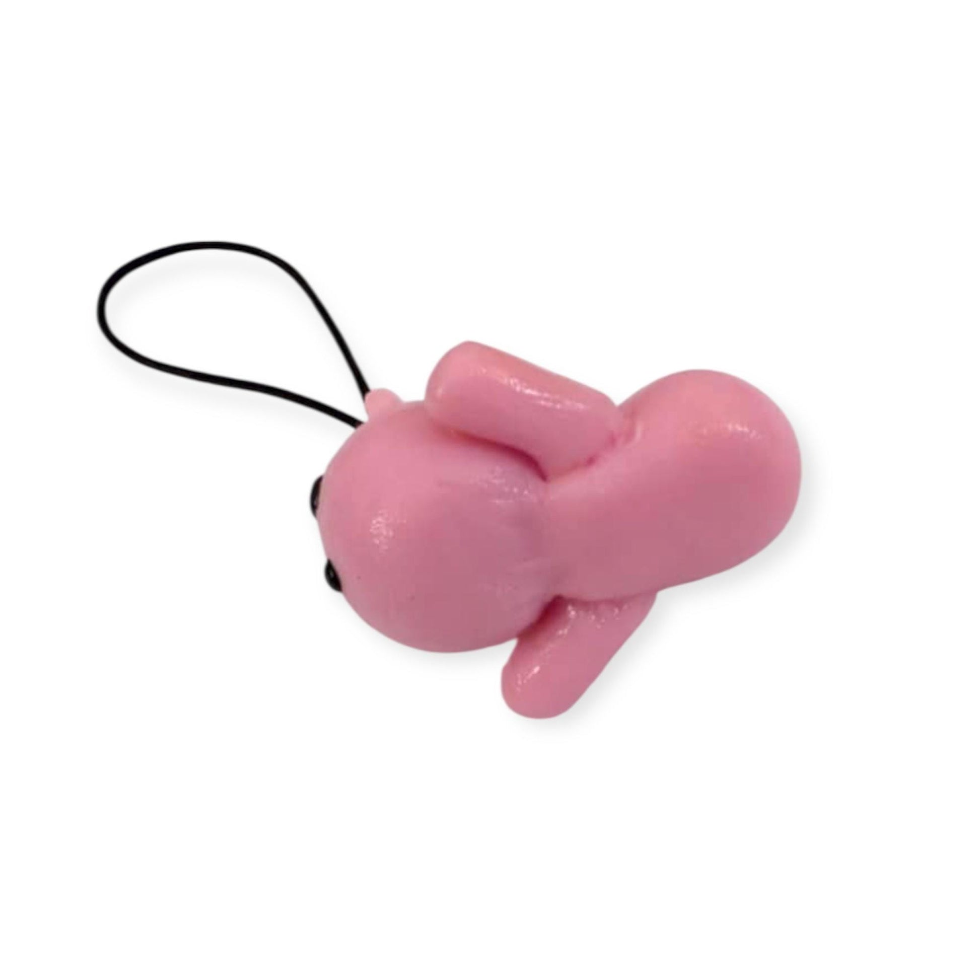 Pink cat shaped keychain on a white background