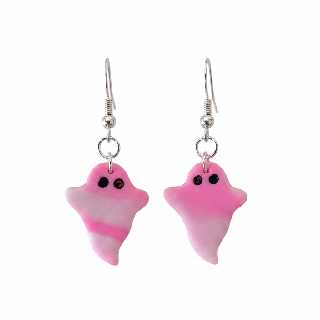 Pink ghost-shaped earrings on a white background