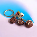 Keychain with chocolate-themed charms on a gradient background