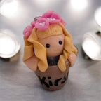 Chibi polymer clay plant out lady with blonde hair and pink flowers, handmade custom keyring UK