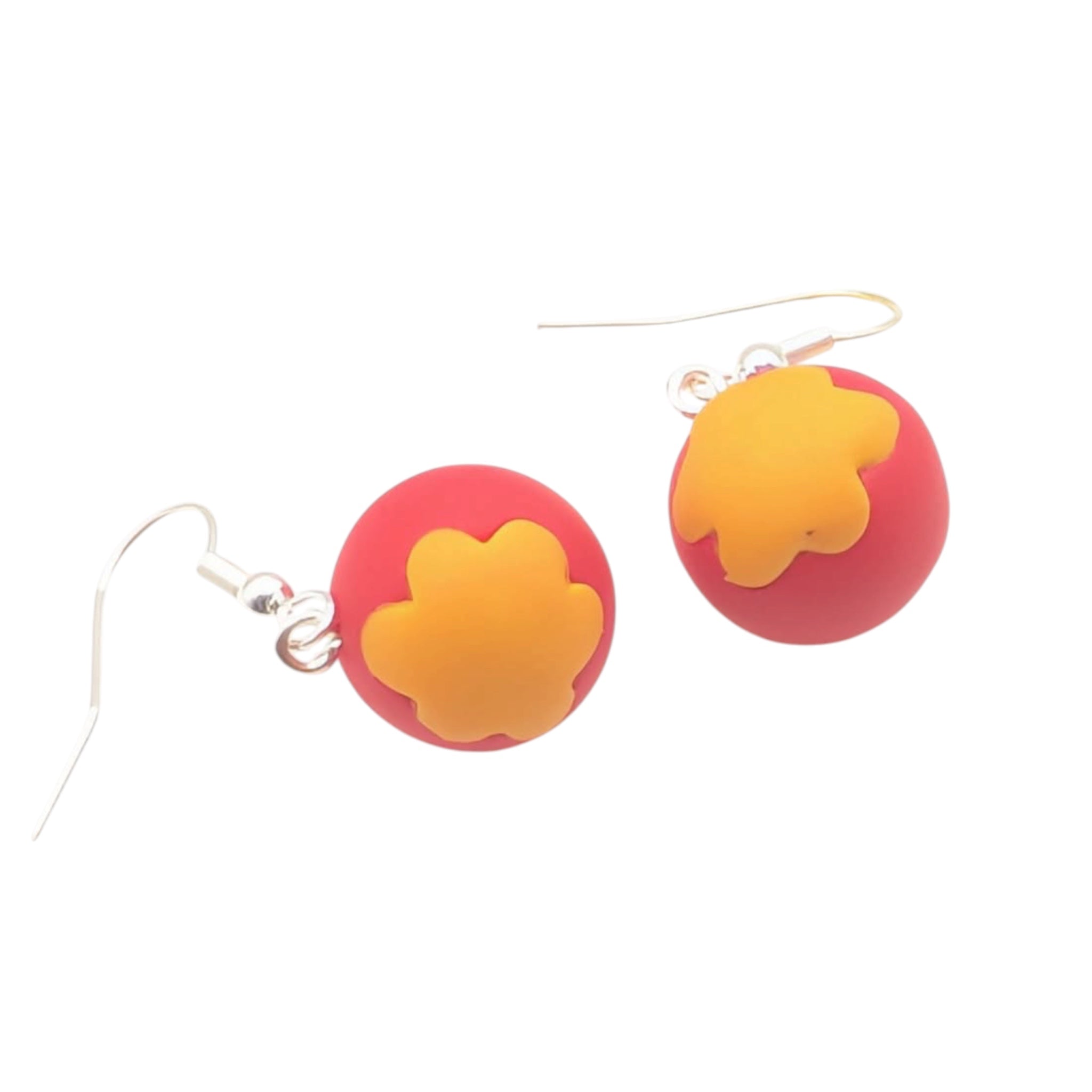 Detail shot of these handmade circus ball earrings showing texture and colour