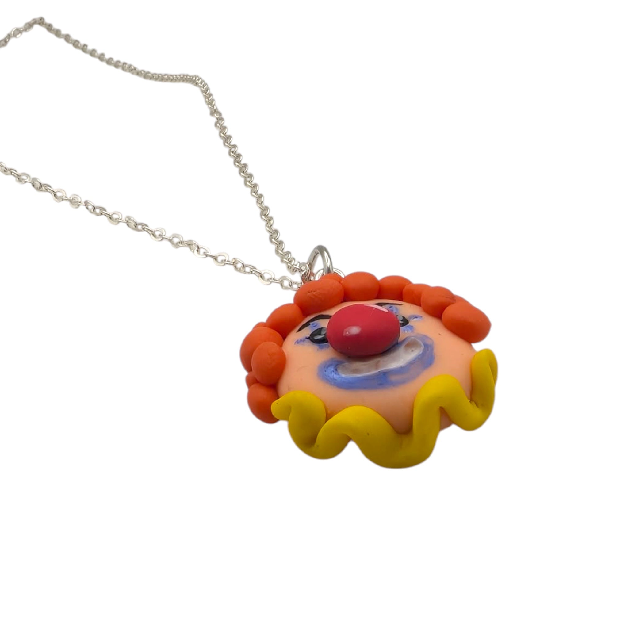  Detail shot of this hand-painted clown necklace charm showing texture and colou