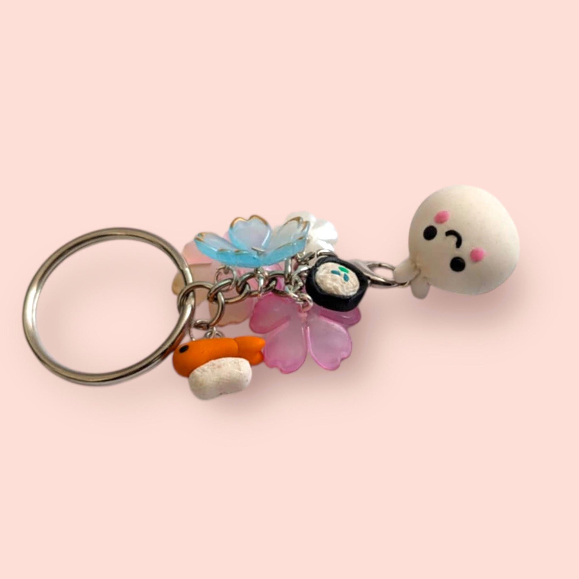 Keychain with colorful charms on a pink background