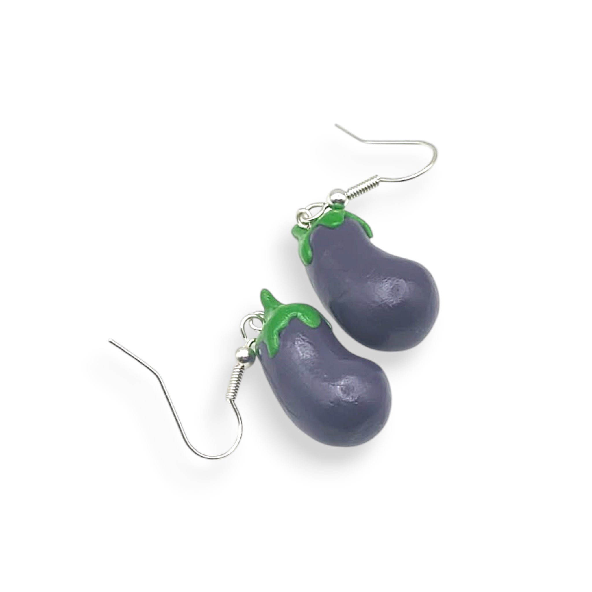 Polymer clay mini food eggplant-shaped earrings on a white background