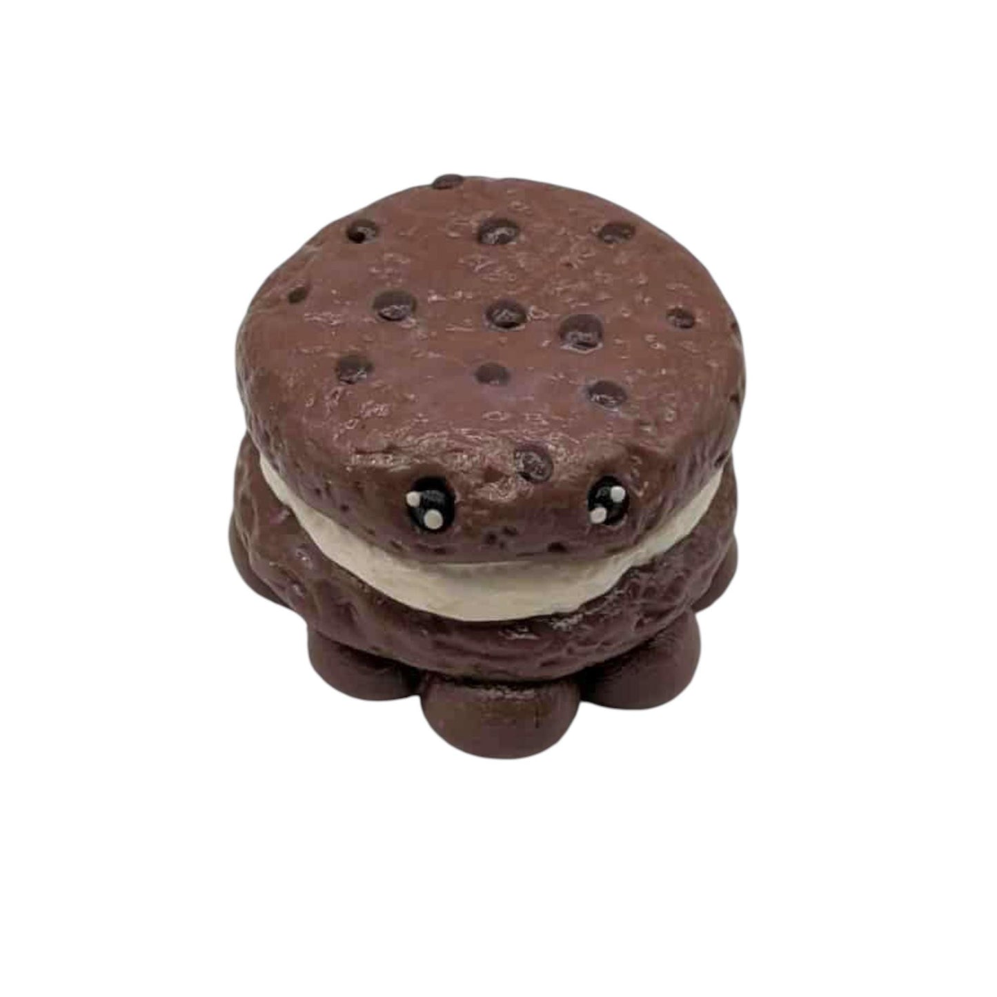 Chocolate cookie with a white filling on a white background