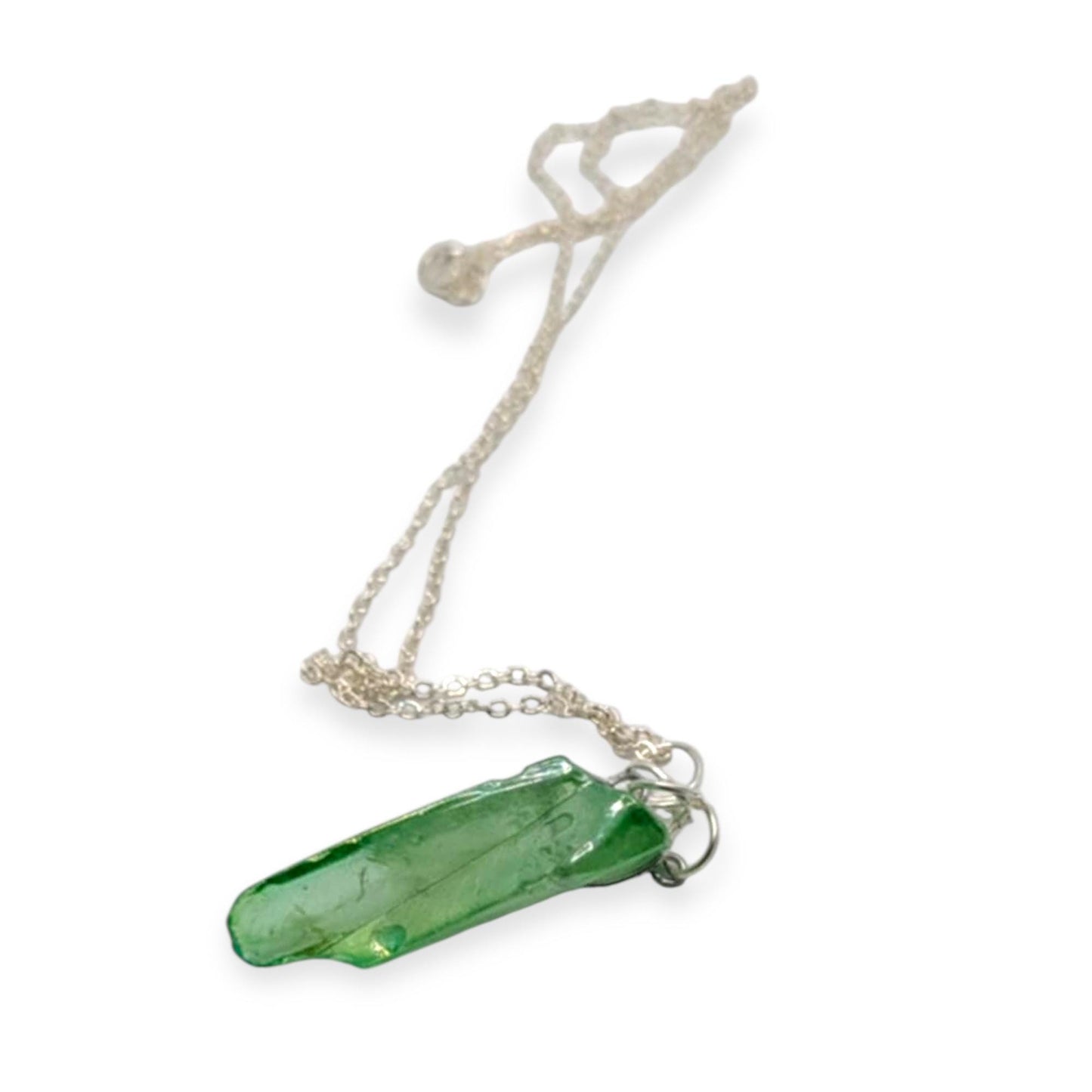 Necklace with a green crystal pendant on a white background