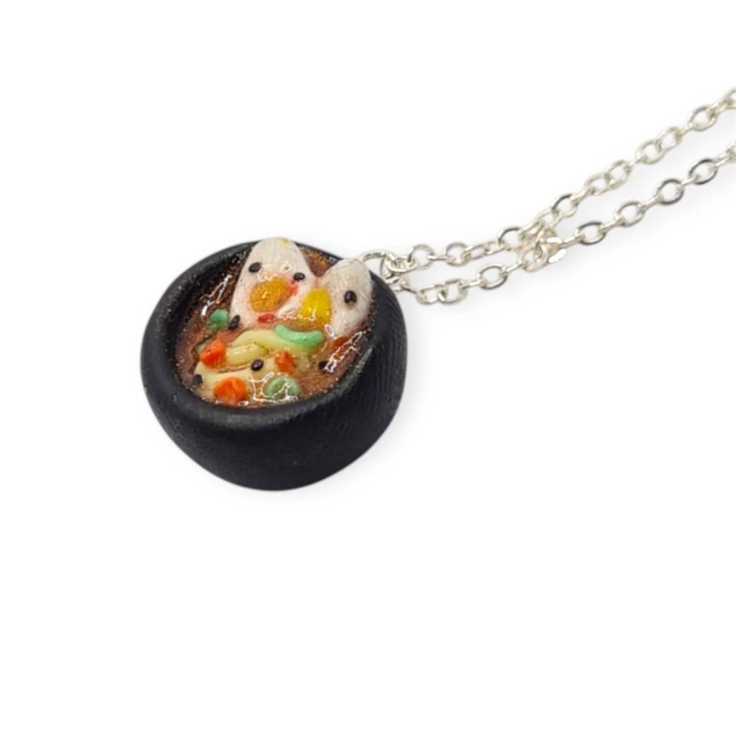 Necklace with a small pendant featuring a ramen bowl on a white background