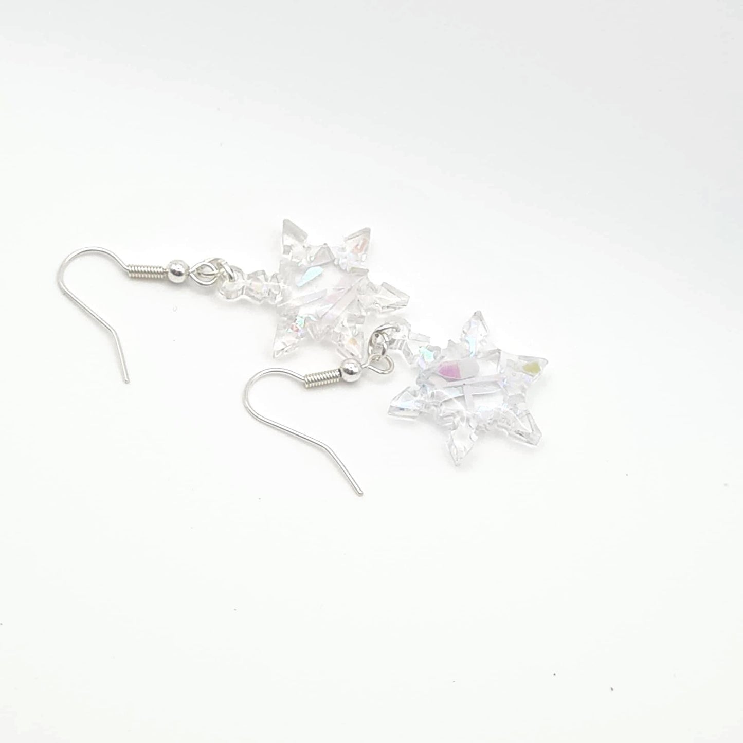 Crystal snowflake earrings on a white background