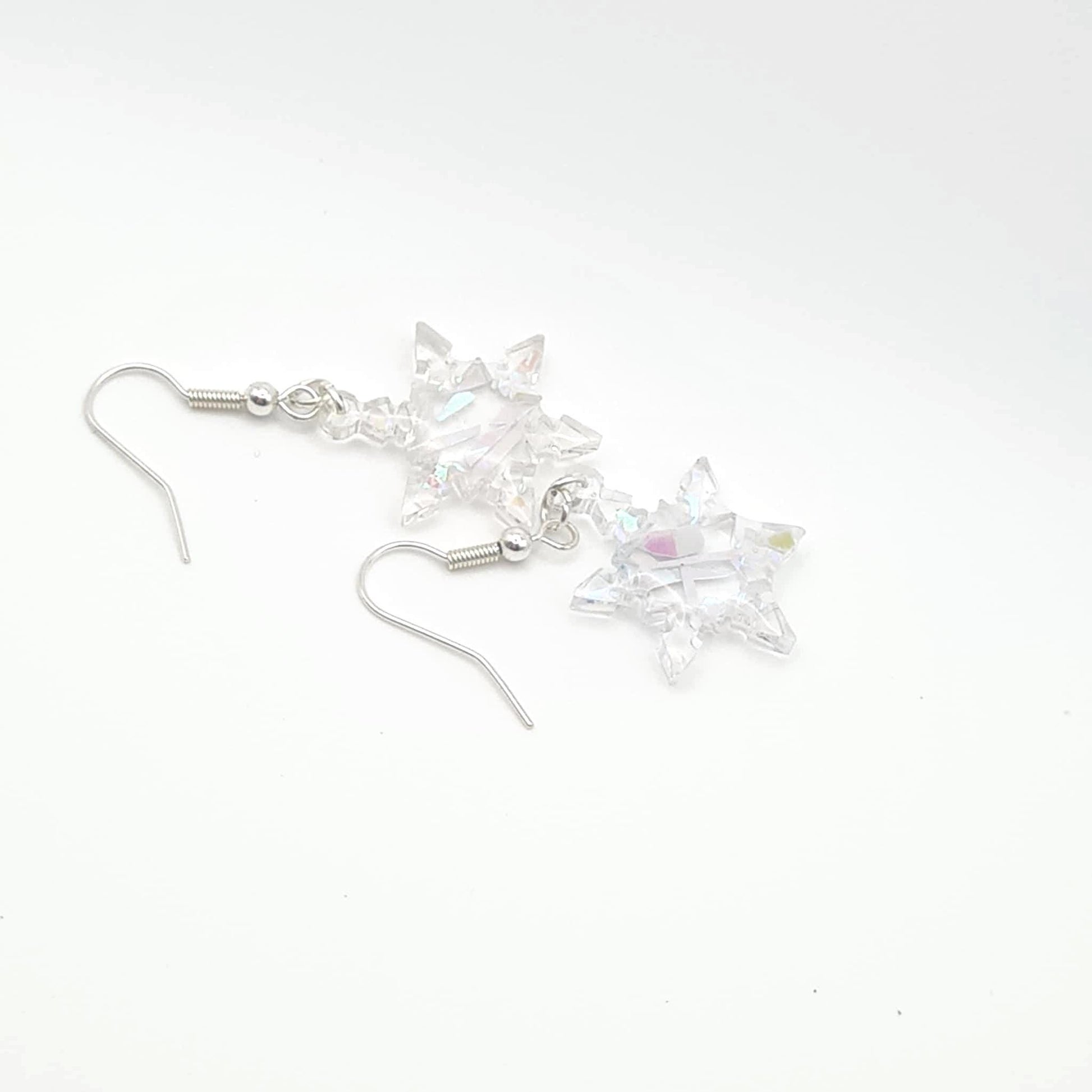 Crystal snowflake earrings on a white background