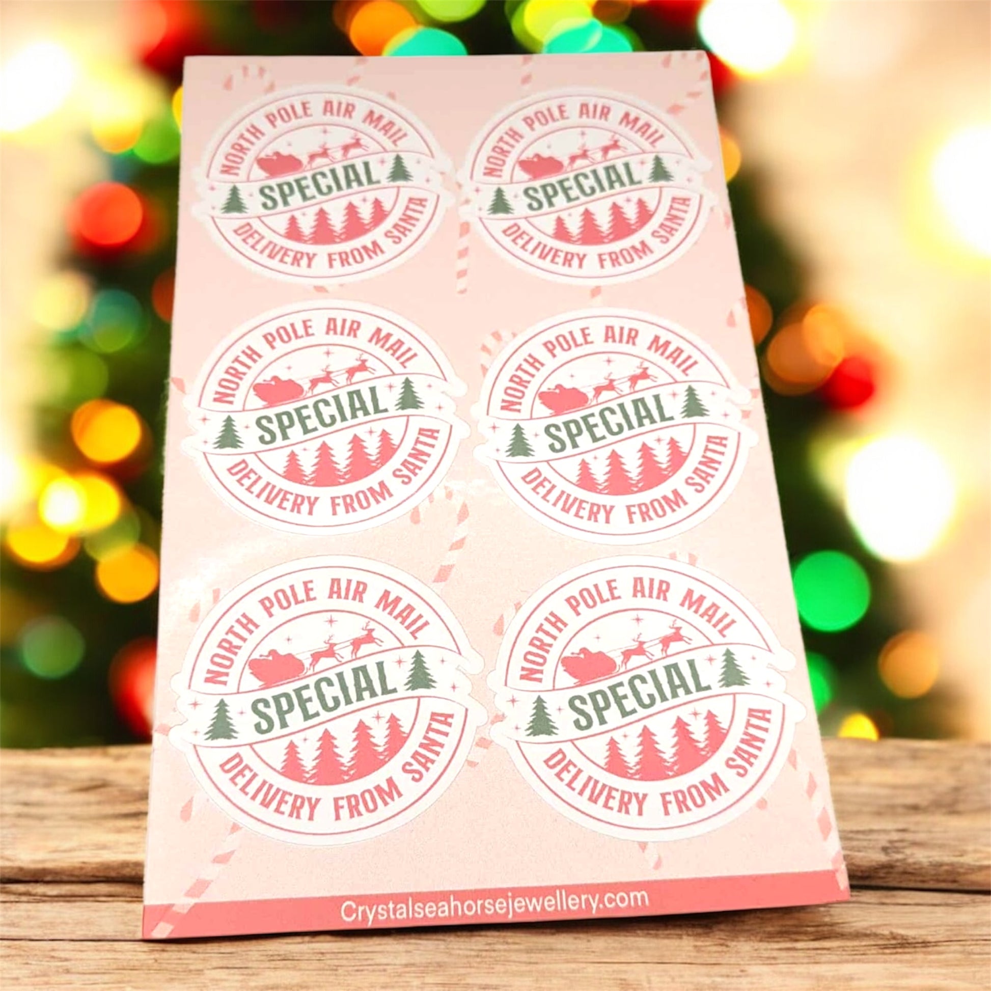 Package with 'Special Delivery from Santa' stamps on a wooden surface with a festive background