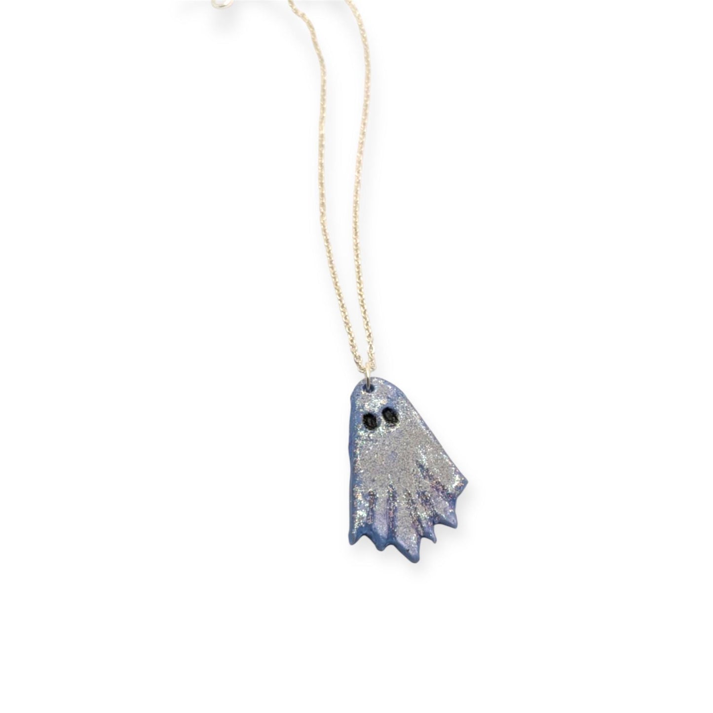 Ghost-shaped pendant on a chain against a white background