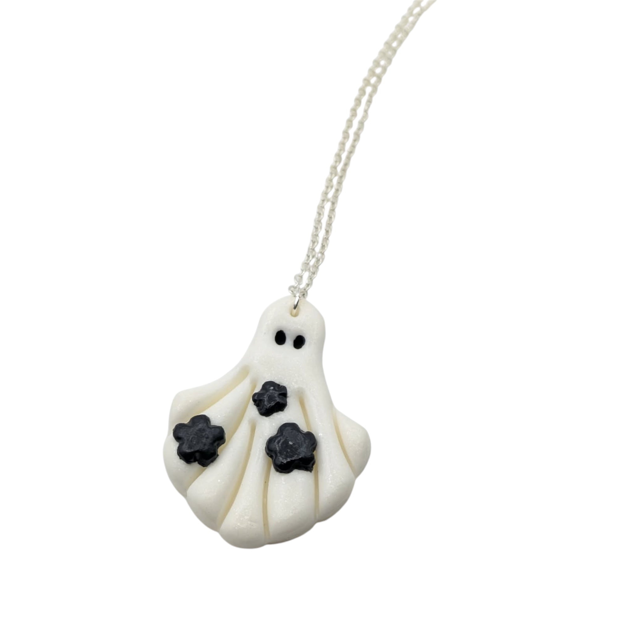 Ghost-shaped pendant necklace on a white background
