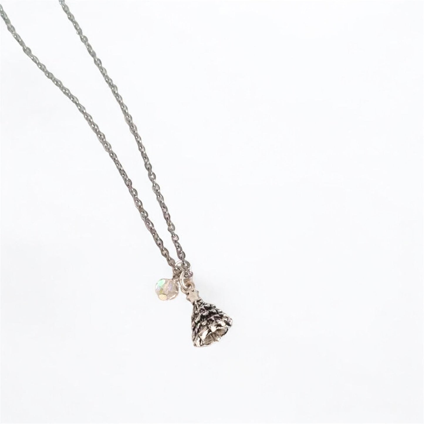 Necklace with a small pendant on a white background