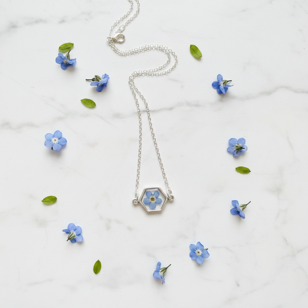 simple forget me not real flower In silver  shaped hexagon  pendant on a silver chain with lobster clasp closure. 