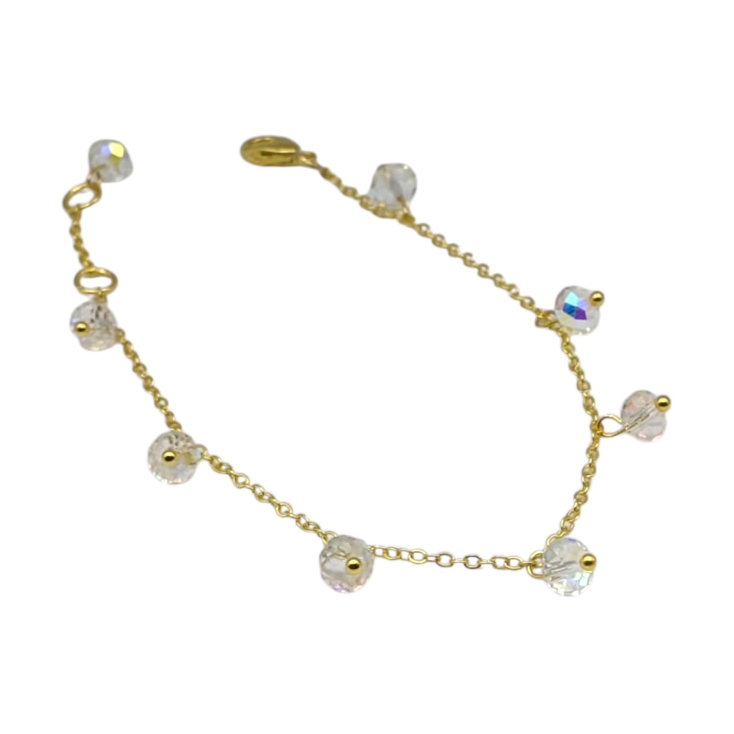 Gold plated chain bracelet with crystal drops on white background 