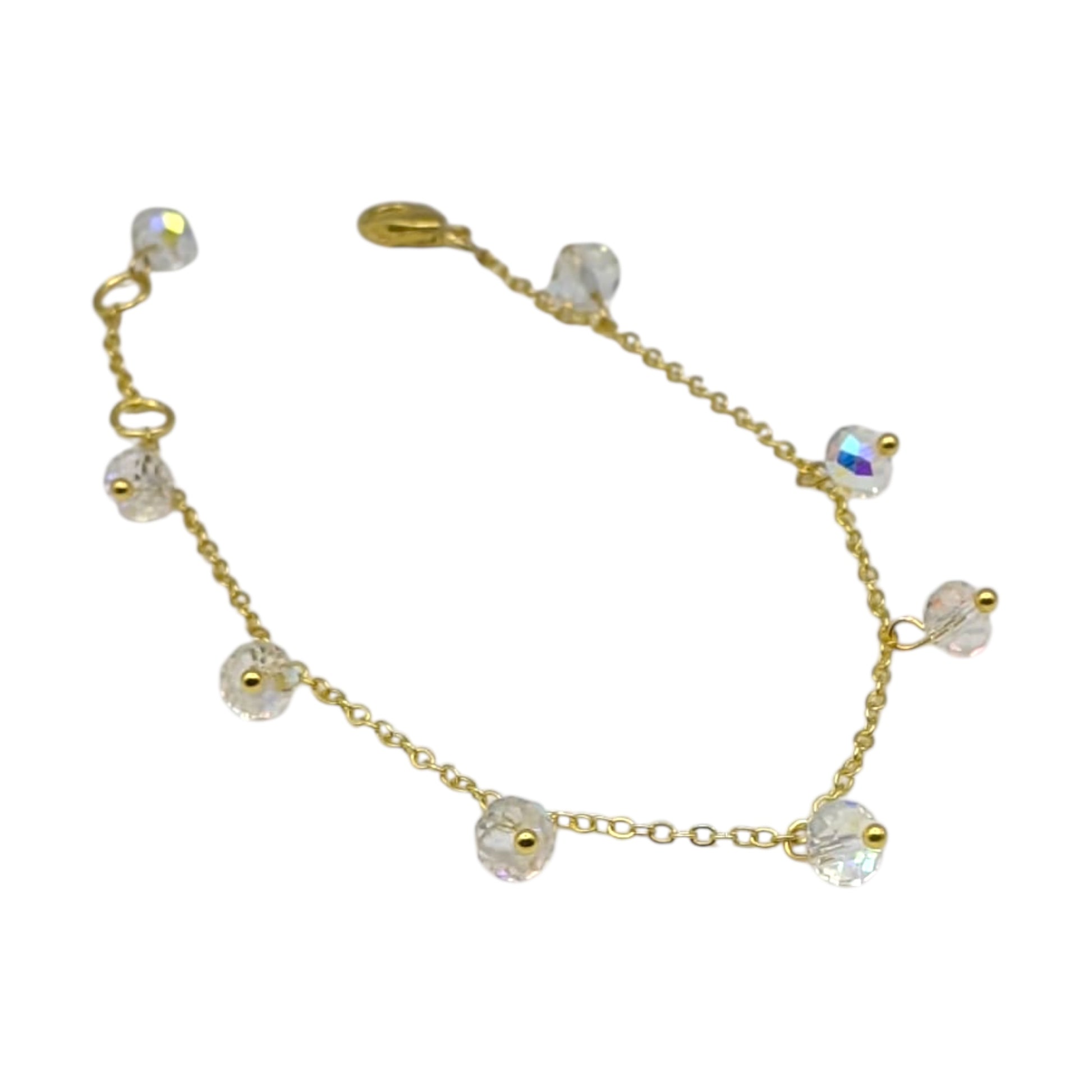 Gold plated chain bracelet with crystal drops on white background 