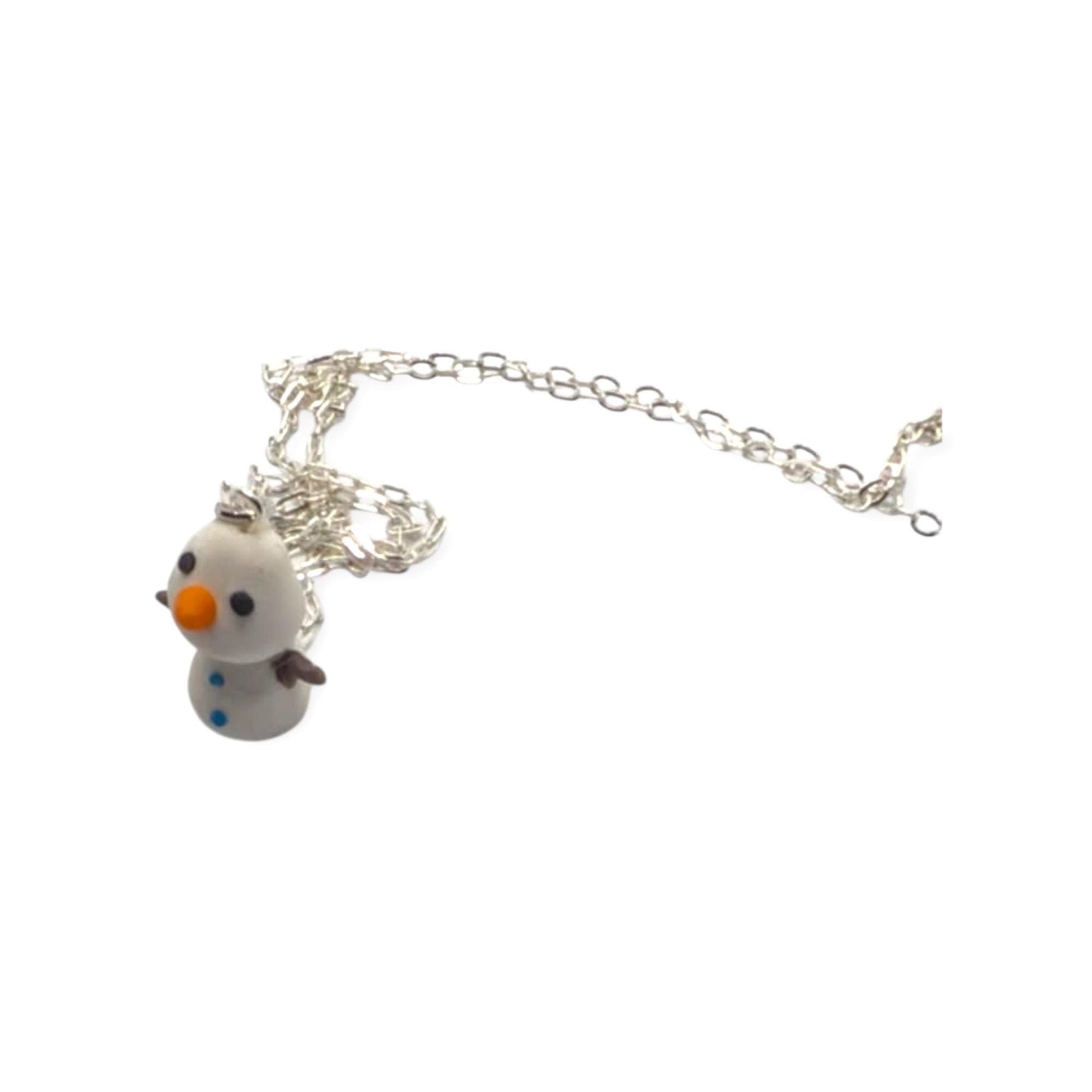 Snowman-shaped pendant on a silver chain against a white background