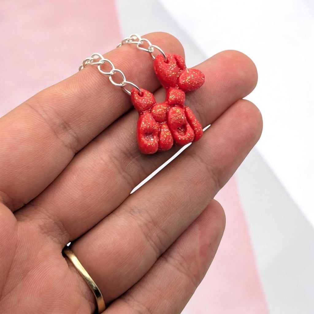 sparkling red balloon dog necklaces on silver-tone chains