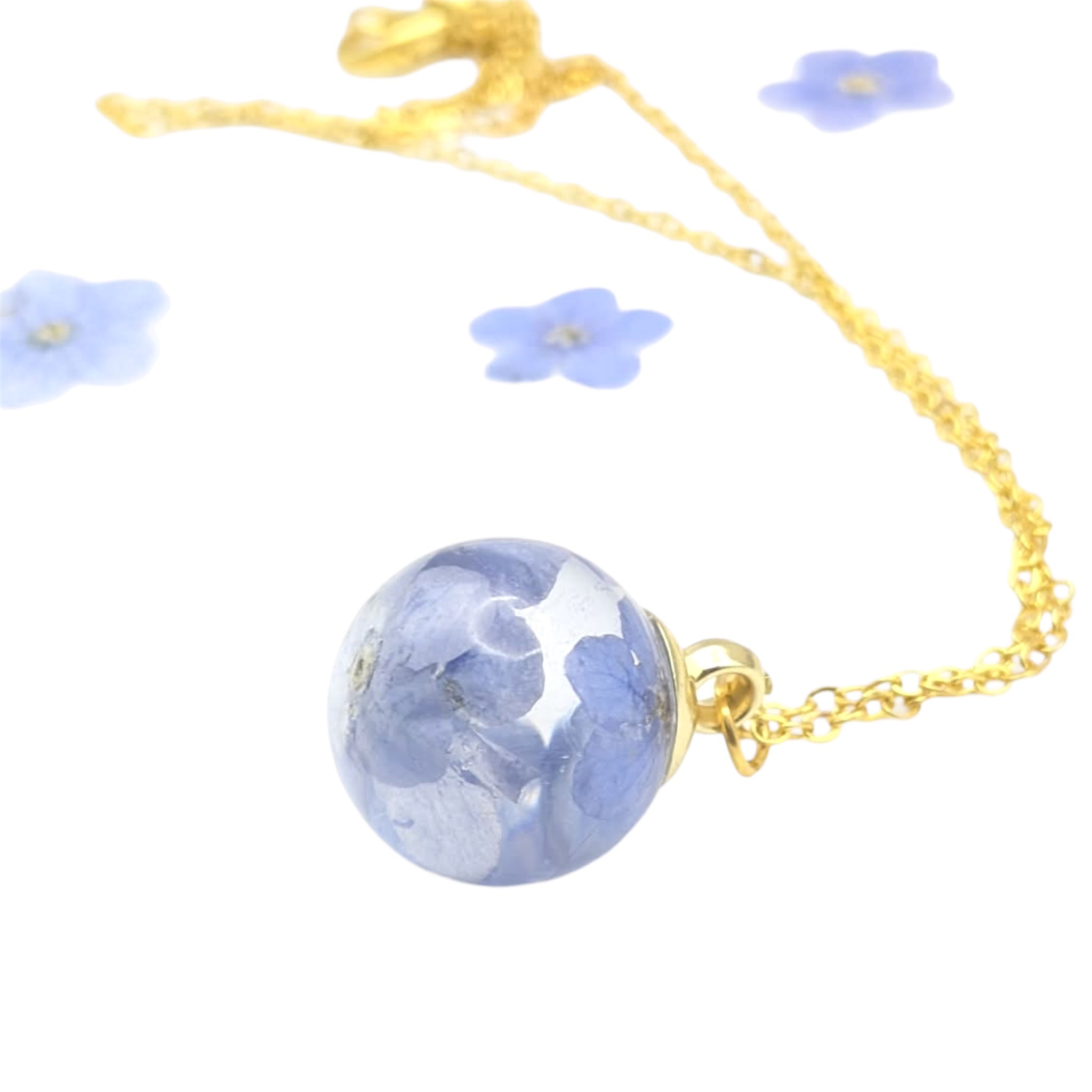 Necklace with a blue floral pendant on a white background