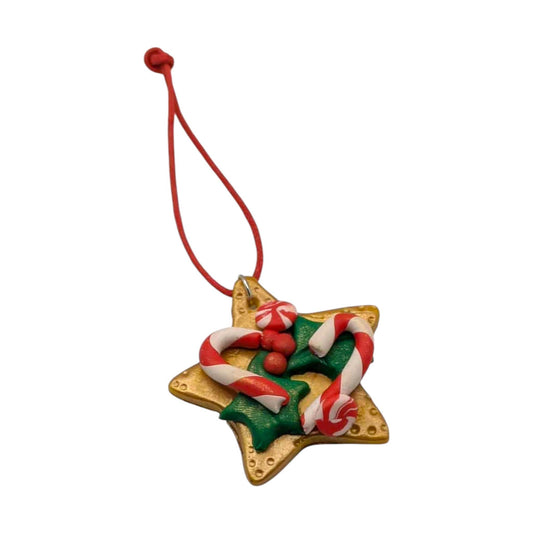 Star-shaped Christmas ornament with candy cane design on a white background