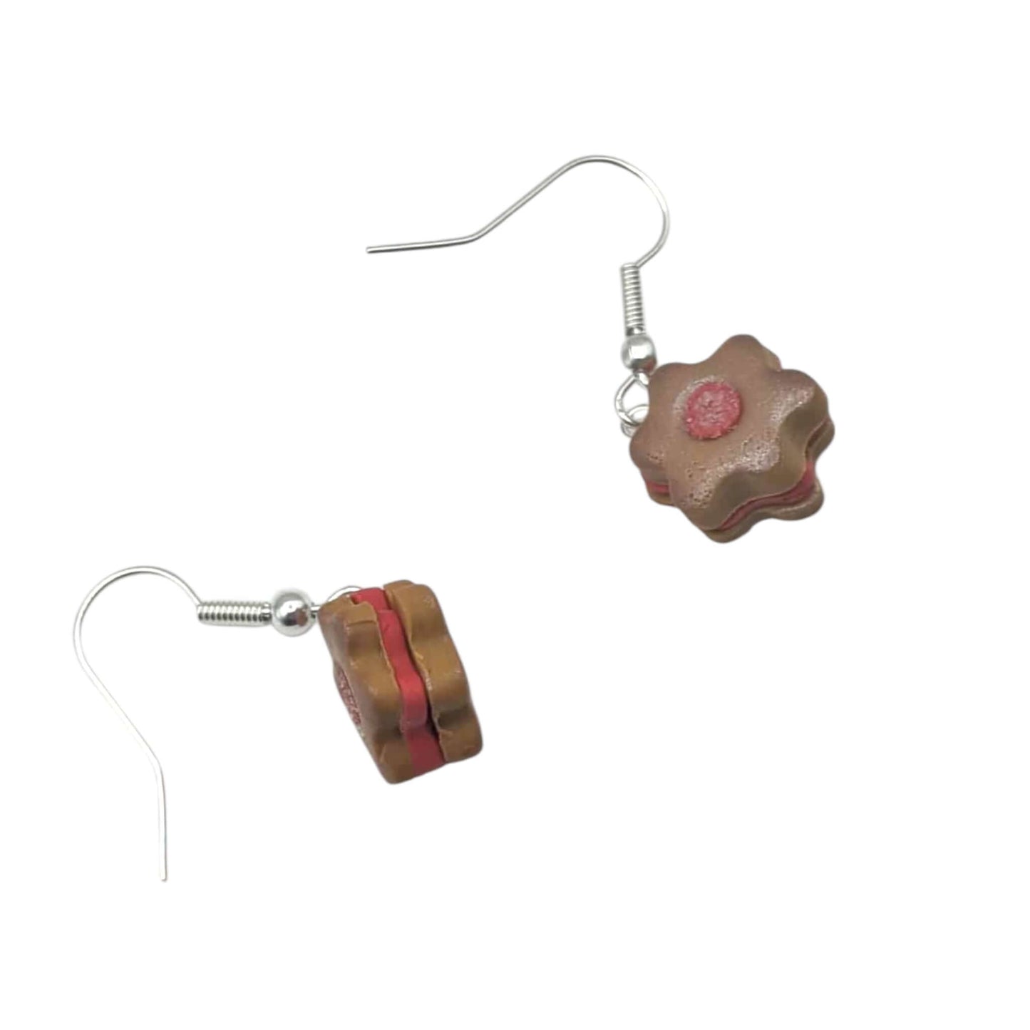 Polymer clay earrings with red accent on a white background