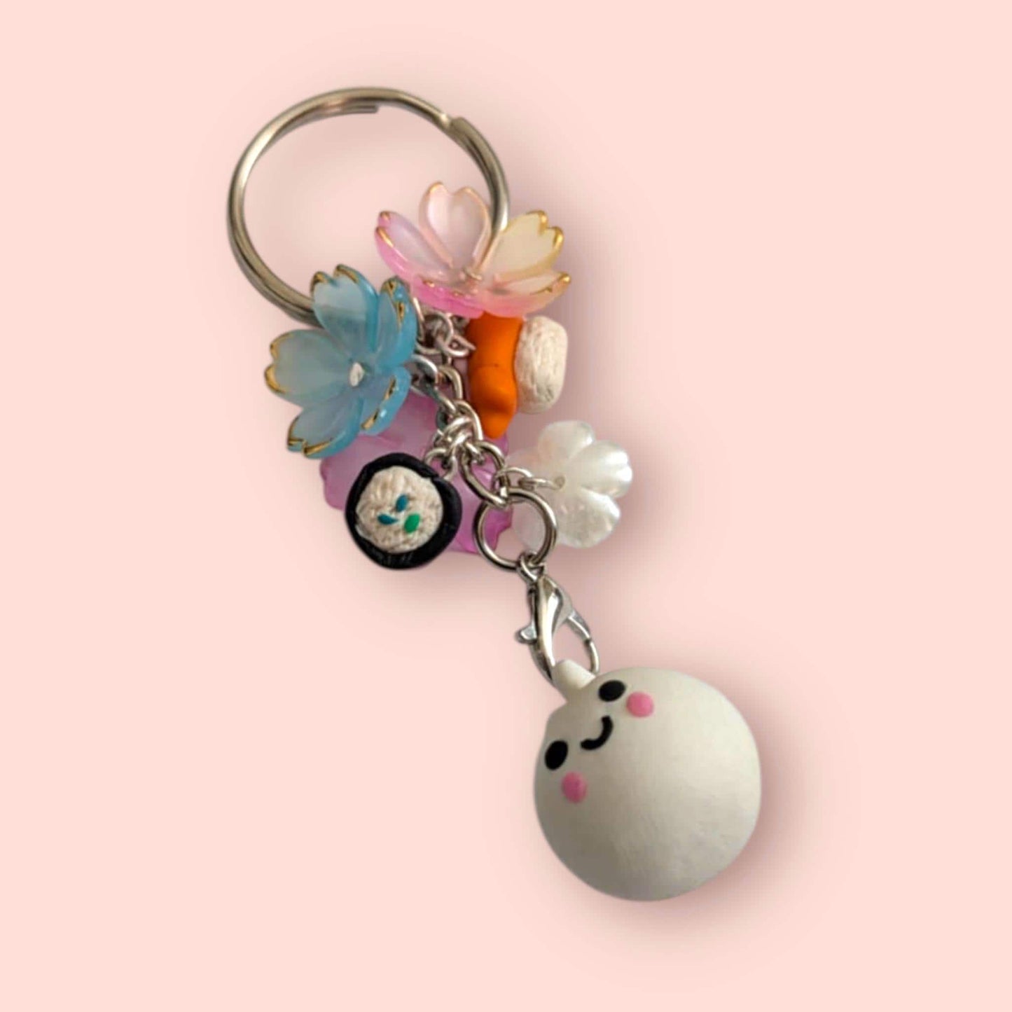 Keychain with colorful charms on a pink background