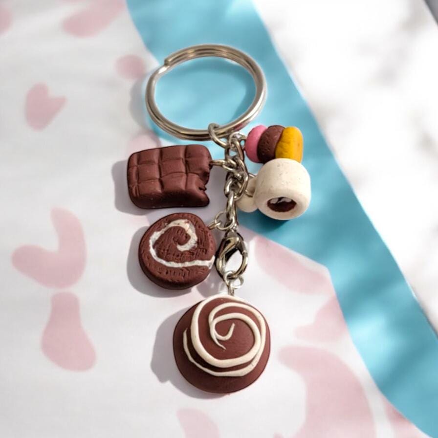 Keychain with chocolate-themed charms on a soft background