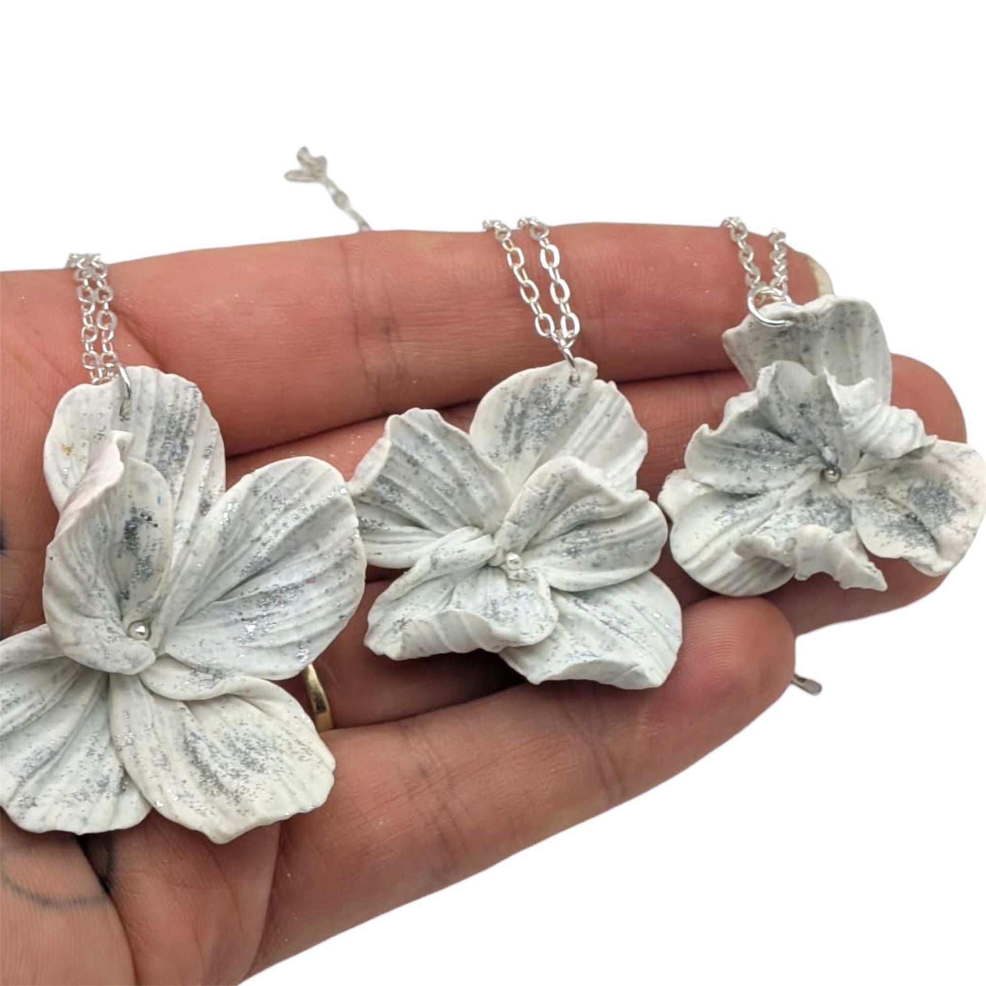 White floral silver necklace worn on hand - bridal accessory
