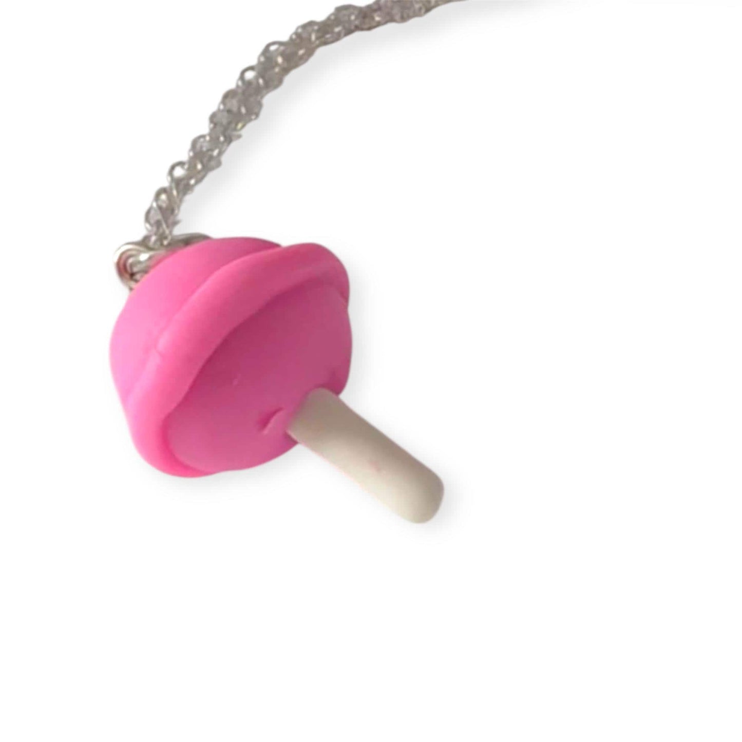 Pink pop charm on a chain against a white background