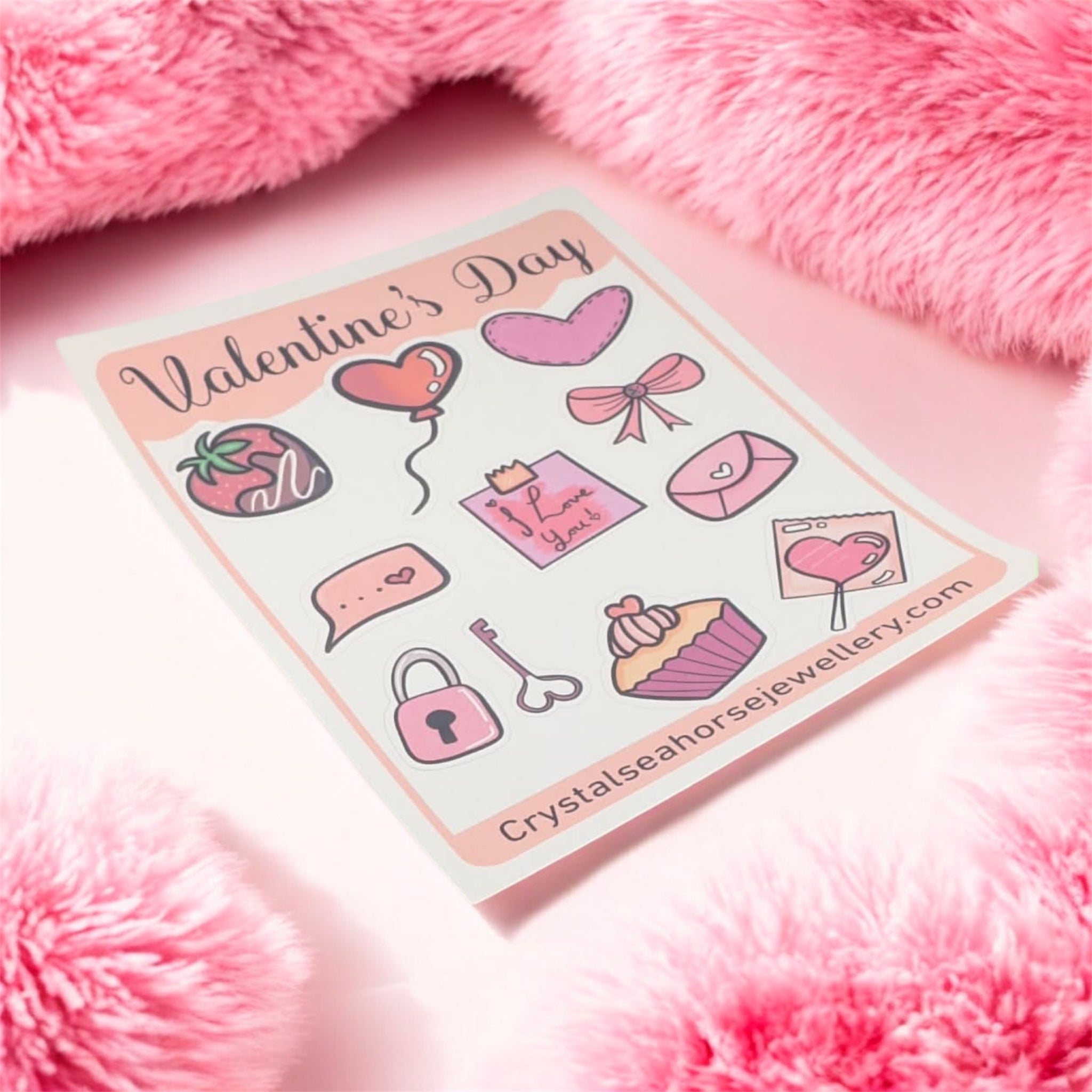Sheet of Valentine's Day-themed stickers on a pink fluffy background