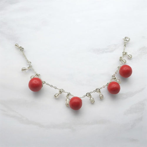Bracelet with 4 red tomato’s on silver chain with crystal glass accents 